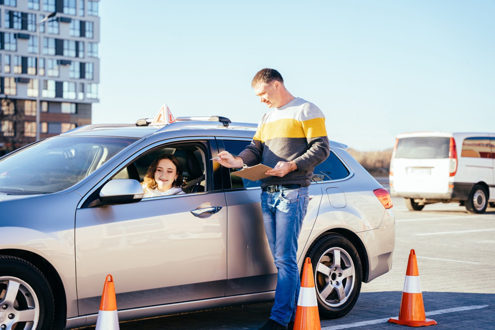 driving-instructor-teaching-teen-in-car-during-tes-2026-01-19-18-42-29-utc